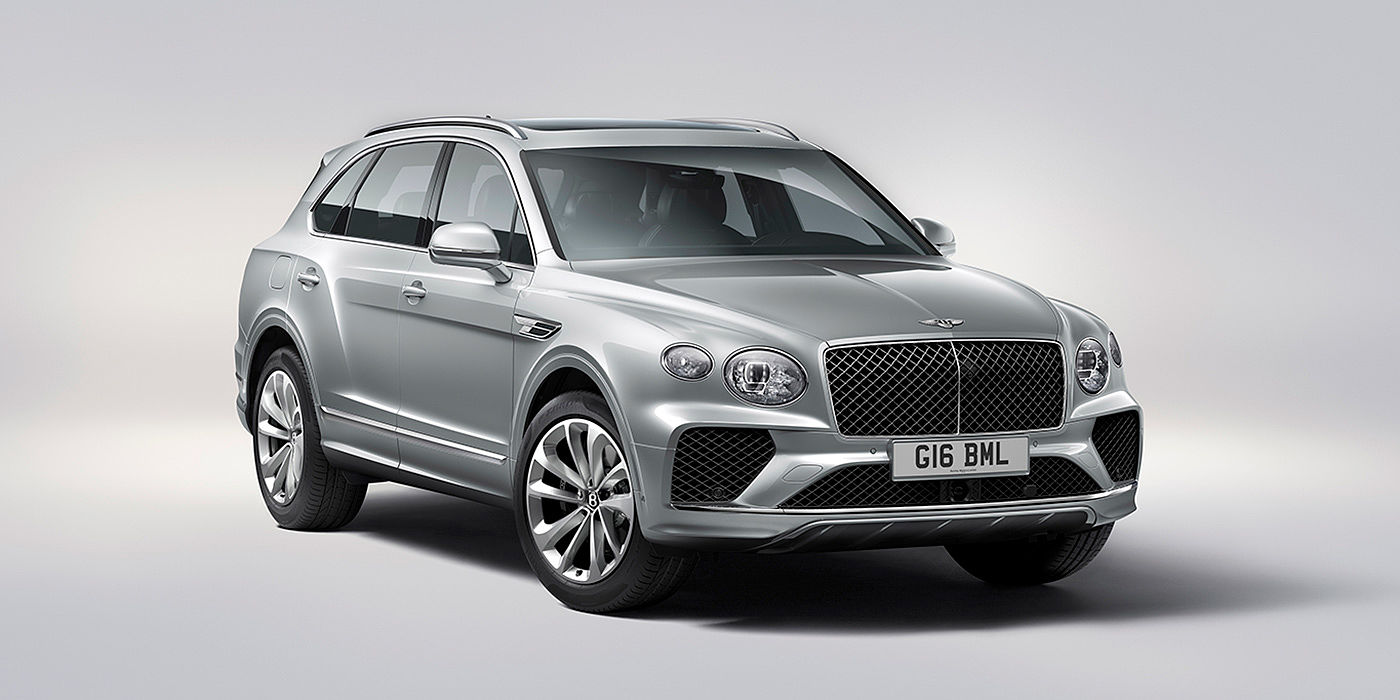 Bentley Doha Bentley Bentayga in Moonbeam paint, front three-quarter view, featuring a matrix grille and elliptical LED headlights.