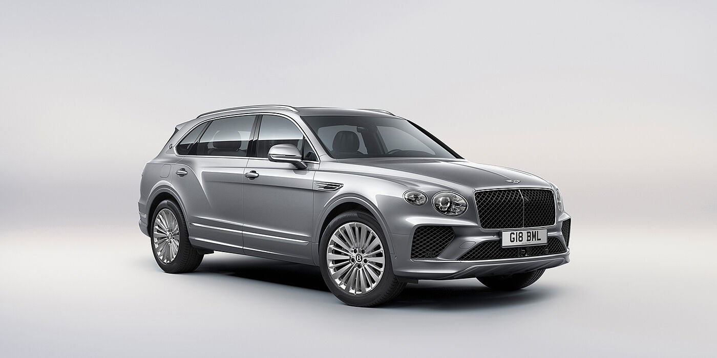 Bentley Doha Bentley Bentayga Extended Wheelbase luxury SUV front three quarter view in Moonbeam paint with 21 inch five spoke painted wheels