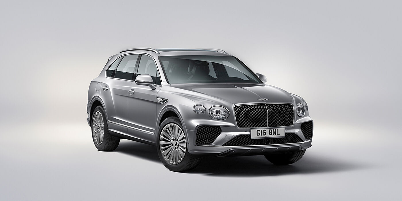 Bentley Doha Bentley Bentayga luxury SUV front three quarter view in Moonbeam paint with matrix grille and 21″ 5 spoke painted wheels