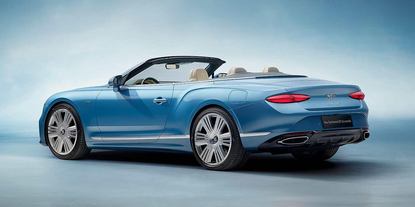 Bentley Doha New Bentley Continental GTC Azure convertible rear view in Light Windsor blue paint with 22 inch ten spoke wheels and chrome exterior details