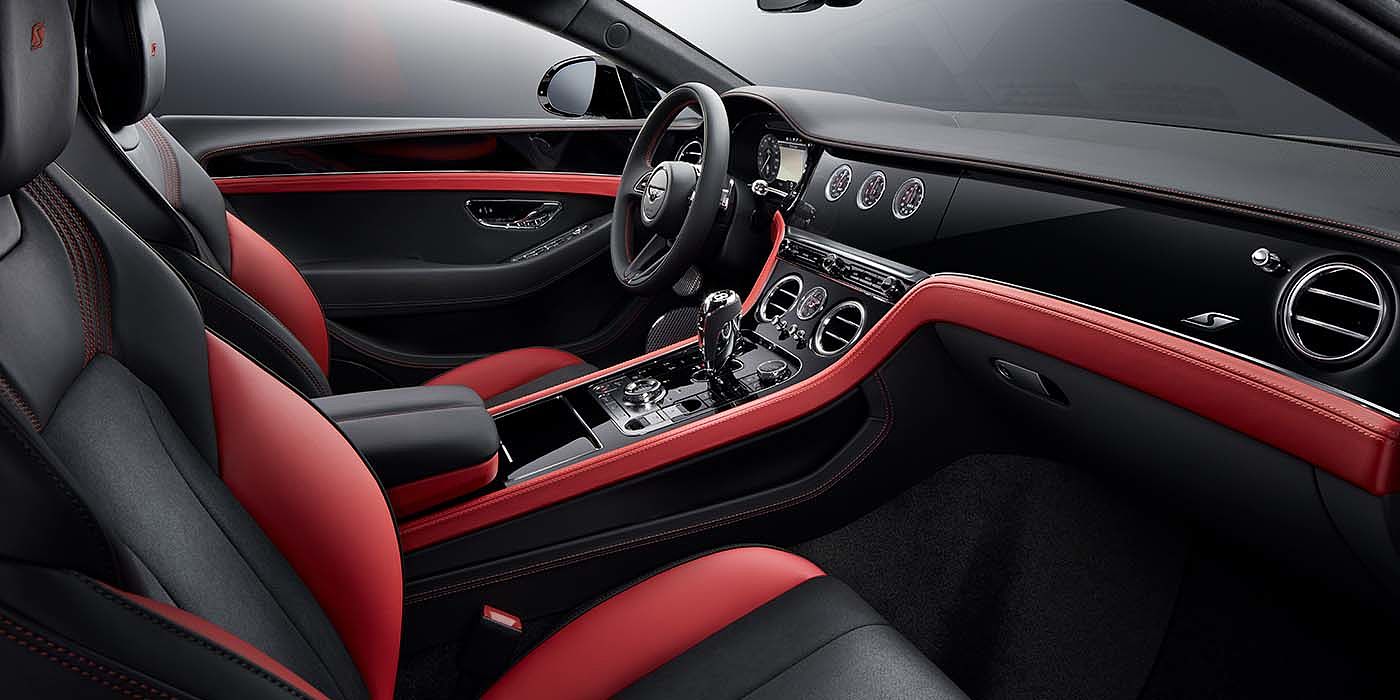 Bentley Doha Bentley Continental GT S coupe front interior in Beluga black and Hotspur red hide with high gloss Carbon Fibre veneer