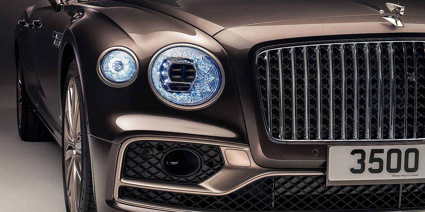 Bentley Doha Bentley Flying Spur Odyssean sedan front grille and illuminated led lamps with Brodgar brown paint