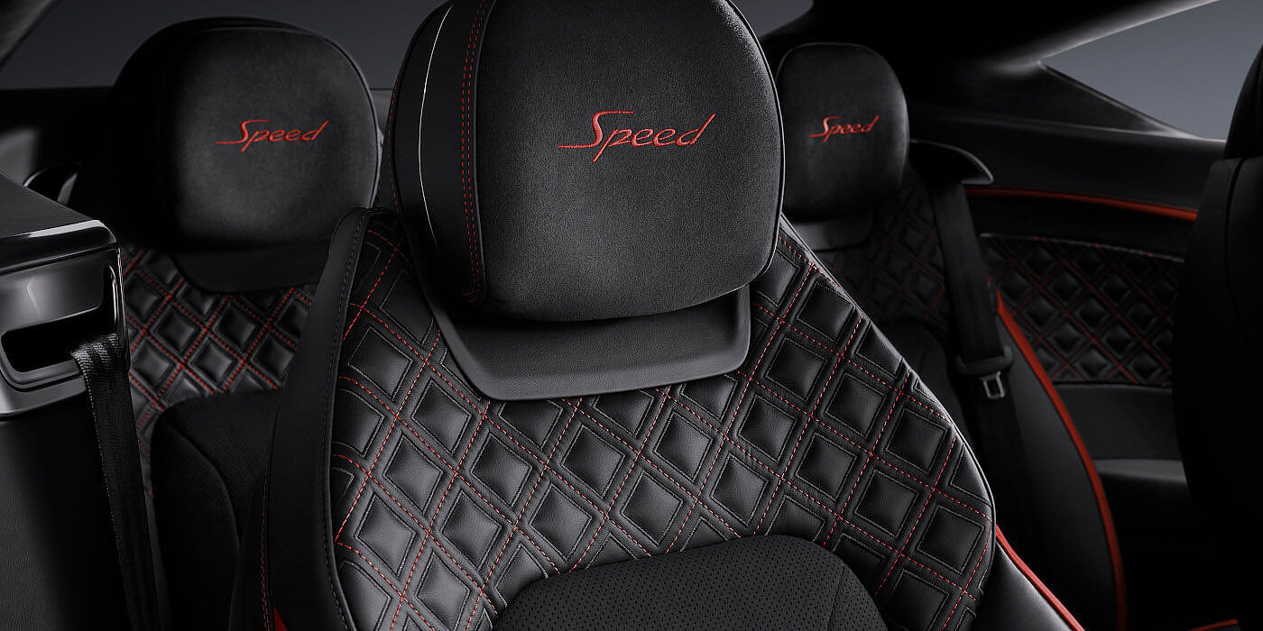 Bentley Doha Bentley Continental GT Speed coupe seat close up in Beluga black and Hotspur red hide