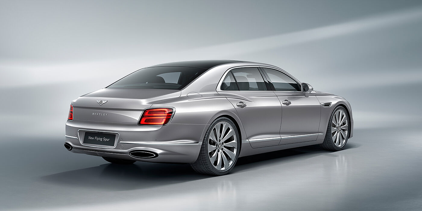 Bentley Doha New Bentley Flying Spur sedan rear view in Silverlake paint with ten spoke wheels and chrome matrix grille