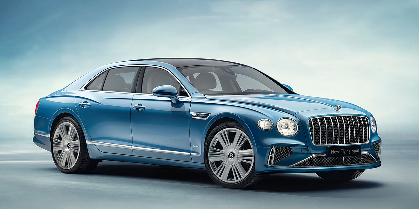 Bentley Doha New Bentley Flying Spur Azure sedan front view in Light windsor blue by Mulliner paint with 22 inch Azure wheels and chrome exterior details