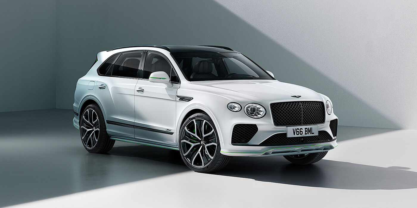 Bentley Doha Bentley Bentayga Speed SUV front three quarter in Snow Quartz Pearlescent by Mulliner white paint against a grey wall