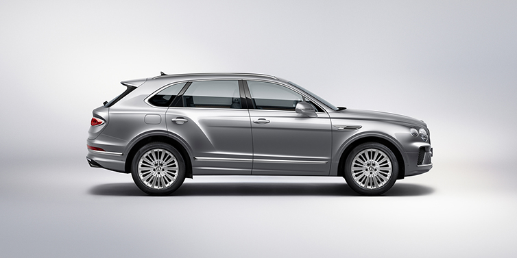 Bentley Doha Bentley Bentayga SUV side profile in Moonbeam silver paint against white background featuring 21 inch 5 spoke wheels